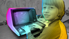 In a photograph from 1981, a third grader works with a desktop computer he programmed to help him with math.