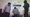 Travelers walk past a “Security Checkpoint” sign in an airport, as a security guard looks on.